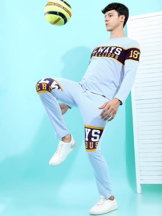 e006c1ee-105e-429d-8db8-76f1b85af8dc1670477638119HIGHLANDERMenBlueTypographyPrintedTrackPants2